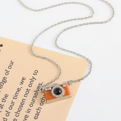 Instante Eterno – Collar Cámara con Foto